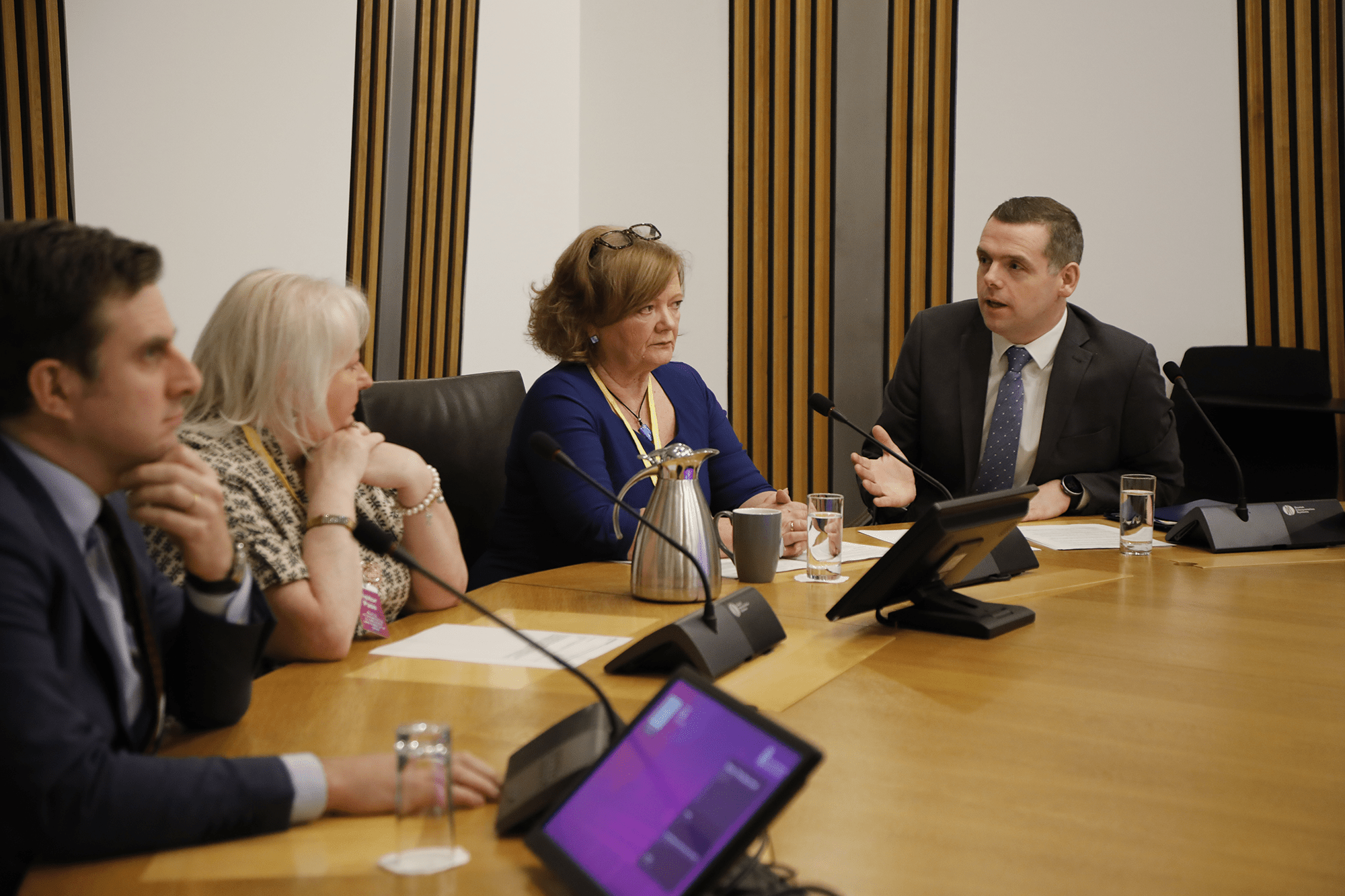 A picture of Daniel Johnson MSP, who introduced the Restraint and Seclusion in Schools (Scotland) Bill, Beth Morrison and Kate Sanger, who have campaigned on these issues for several years, sitting alongside the Convener, Douglas Ross MSP.